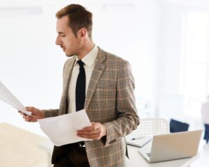 Business owner reviewing commercial lease documents